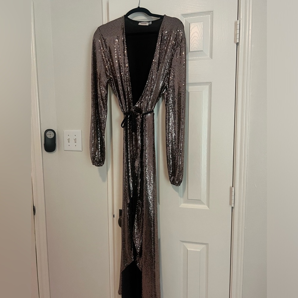 Gold shimmer wrap dress. Size: L. Fits anywhere from a 10-14. Worn once.